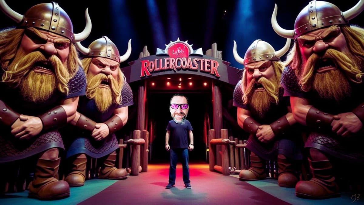 Image of CJB standing in middle of angry tall vikings at a rollercoaster ride entrance